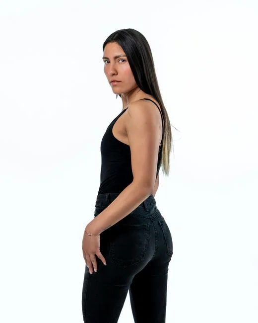 Businesswoman working on laptop with Android 6.0 Marshmallow webpage open.