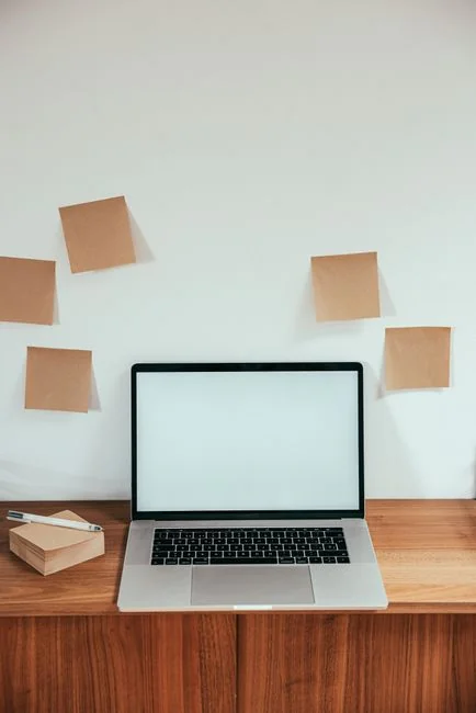 A modern computer screen displaying web design work, showcasing creative visuals in a workspace.